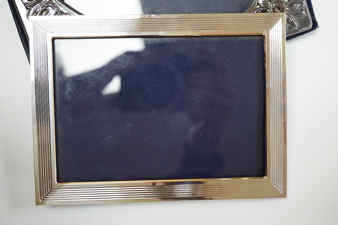 A pair of modern silver mounted photograph frames, 20.8cm and matching larger frame, 23.2cm, by Carr's of Sheffield, Ltd, Sheffield, 1996, together with one other modern silver mounted photograph frame and a similar Ital